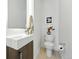 Modern half bathroom with sleek vanity, stylish fixtures, and minimalist design for a contemporary touch at 4394 Zenobia St, Denver, CO 80212