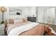 Modern bedroom with a comfortable bed, stylish decor, and plenty of natural light at 4394 Zenobia St, Denver, CO 80212