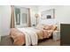 Cozy bedroom with a large window, comfortable bed, and warm inviting decor at 4394 Zenobia St, Denver, CO 80212