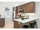 Modern kitchen featuring stainless steel appliances, white countertops, and stylish wood cabinetry for a contemporary design at 4394 Zenobia St, Denver, CO 80212