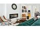 Chic living room features a modern fireplace, stylish furniture and decor, creating a cozy and inviting atmosphere at 4394 Zenobia St, Denver, CO 80212