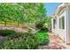 Backyard featuring well-maintained lawn, wooden fence, and mature trees, offering a serene outdoor space at 7211 Dolomite Ln, Castle Rock, CO 80108