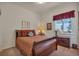 Cozy bedroom boasts a comfortable bed, window view, and quaint decorative touches at 7211 Dolomite Ln, Castle Rock, CO 80108