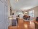 Inviting entryway with hardwood floors, staircase, and dining area with natural light at 7211 Dolomite Ln, Castle Rock, CO 80108