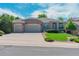 Beautiful single-story home featuring brick exterior, two-car garage, and manicured landscaping at 7211 Dolomite Ln, Castle Rock, CO 80108