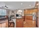 Open kitchen featuring granite countertops, stainless appliances, and seamless living space integration at 7211 Dolomite Ln, Castle Rock, CO 80108