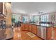 Bright kitchen with stainless steel appliances, a breakfast bar, and a view to the living area at 7211 Dolomite Ln, Castle Rock, CO 80108