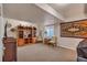 Finished basement living area has a decorative hutch and comfortable seating at 7211 Dolomite Ln, Castle Rock, CO 80108