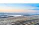 Scenic aerial view of a vast, flat landscape with a highway and a distant lake at 4286 S Cole St, Morrison, CO 80465