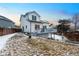 View of the backyard with a well-maintained lawn and a deck attached to the house at 4286 S Cole St, Morrison, CO 80465