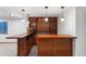 Finished basement bar with custom wood cabinetry, offering a perfect space for entertaining and relaxation at 4286 S Cole St, Morrison, CO 80465