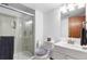 Clean bathroom with a glass-enclosed shower, neutral tile, and a white vanity, creating a functional space at 4286 S Cole St, Morrison, CO 80465