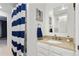 Bright bathroom featuring a granite countertop, a vanity, and nautical decor, offering a fresh and stylish space at 4286 S Cole St, Morrison, CO 80465