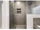 Glass-enclosed shower features a rain shower head, a standard shower head, and tiled walls at 4286 S Cole St, Morrison, CO 80465