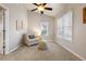 Bright bedroom with comfortable armchair, lots of natural light, and neutral colored walls at 4286 S Cole St, Morrison, CO 80465