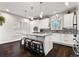 Modern kitchen featuring an island, stainless steel appliances, pendant lighting, and backsplash at 4286 S Cole St, Morrison, CO 80465