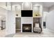 This living room features a fireplace, built-in shelving, and vaulted ceilings at 4286 S Cole St, Morrison, CO 80465