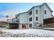 Exterior of a two-story house with white siding, a spacious deck, and a well-kept backyard at 4286 S Cole St, Morrison, CO 80465