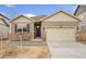 Charming single-Gathering home featuring stone accents, neutral siding, and a two-car garage at 874 Ledge St, Lochbuie, CO 80603