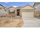 Charming single-Gathering home featuring stone accents, neutral siding, and a two-car garage at 874 Ledge St, Lochbuie, CO 80603