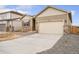Charming single-Gathering home featuring stone accents, neutral siding, and a two-car garage at 874 Ledge St, Lochbuie, CO 80603