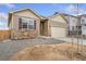 Charming single-Gathering home featuring stone accents, neutral siding, and a two-car garage at 874 Ledge St, Lochbuie, CO 80603