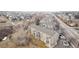Aerial view of the building with parking, neighborhood and nearby road at 1273 S Gilbert St # A103, Castle Rock, CO 80104