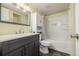 This bathroom features a gray vanity, white countertop, cabinet, and shower-tub combination at 1273 S Gilbert St # A103, Castle Rock, CO 80104
