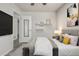 Cozy bedroom featuring a plush bed, neutral decor, and modern lighting fixtures at 1273 S Gilbert St # A103, Castle Rock, CO 80104