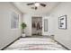 Bedroom with a ceiling fan, closet, and white walls, with a peek at the bed at 1273 S Gilbert St # A103, Castle Rock, CO 80104