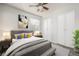 Comfortable bedroom featuring a plush bed, ample closet space, and a ceiling fan at 1273 S Gilbert St # A103, Castle Rock, CO 80104