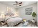 Cozy bedroom with a bed, bedside tables, and a ceiling fan, showcasing a relaxing space at 1273 S Gilbert St # A103, Castle Rock, CO 80104
