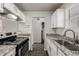 Clean kitchen with stainless steel appliances, granite counters and ample cabinet space at 1273 S Gilbert St # A103, Castle Rock, CO 80104