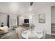 Open floor plan with a living room, dining area, and a sliding glass door leading to a balcony at 1273 S Gilbert St # A103, Castle Rock, CO 80104