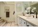 Well-lit bathroom with a double sink vanity and stylish fixtures at 7255 E Quincy Ave # 403, Denver, CO 80237