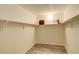 Spacious walk-in closet with wood-look flooring and ample shelving for storage at 7255 E Quincy Ave # 403, Denver, CO 80237