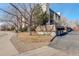 Condo complex with mature trees and tidy landscaping, conveniently located near a sidewalk at 7255 E Quincy Ave # 403, Denver, CO 80237