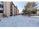 Extensive condo grounds offer lots of yard space and winter landscape with mature trees at 7255 E Quincy Ave # 403, Denver, CO 80237