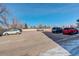 Outdoor parking lot with multiple parked cars on a sunny day, offering convenient parking options at 7255 E Quincy Ave # 403, Denver, CO 80237