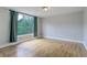 This bedroom offers hardwood floors and a large window at 1324 Virginia St, Idaho Springs, CO 80452