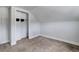 Carpeted bedroom with an open closet space and clean, paneled walls at 1324 Virginia St, Idaho Springs, CO 80452
