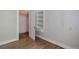 Bedroom features a wood floor, closet, and built-in shelving at 1324 Virginia St, Idaho Springs, CO 80452