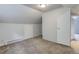 Carpeted bedroom featuring baseboard heating and multiple doorways at 1324 Virginia St, Idaho Springs, CO 80452