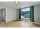 Bright bedroom features hardwood floors and a large window with mountain views at 1324 Virginia St, Idaho Springs, CO 80452