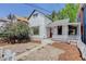 Charming two-story home with a welcoming front porch and a red front door at 1324 Virginia St, Idaho Springs, CO 80452