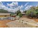 View of the house with beautiful landscaping, fence, and mountain views at 1324 Virginia St, Idaho Springs, CO 80452