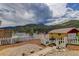 Charming home featuring a white picket fence, mountain views and beautiful landscaping at 1324 Virginia St, Idaho Springs, CO 80452