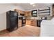 A functional kitchen with black appliances, granite countertops, and lots of storage at 1324 Virginia St, Idaho Springs, CO 80452