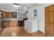Bright kitchen with wood cabinets, stainless appliances, laundry and a skylight at 1324 Virginia St, Idaho Springs, CO 80452