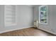 An airy living room offers built-in shelves and lots of natural light at 1324 Virginia St, Idaho Springs, CO 80452